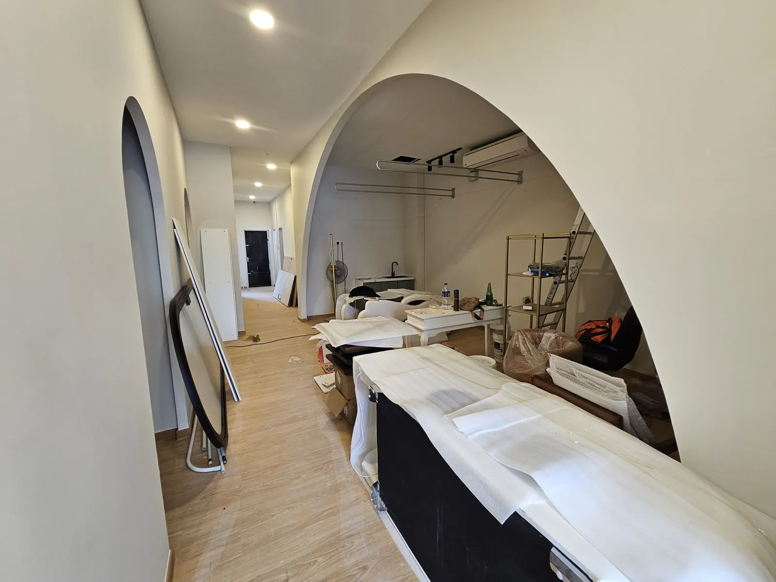 Good Skin Bar arched opening to rear room, furniture wrapped