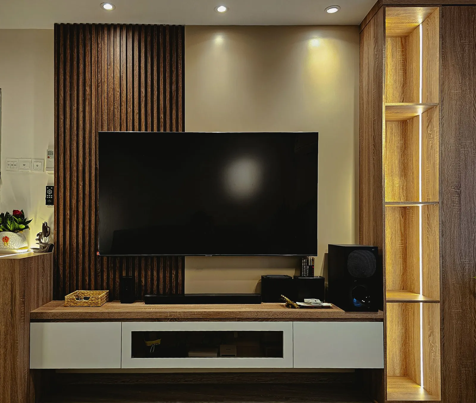 Slatted timber TV feature wall with floating console in a Taman Kesidang apartment