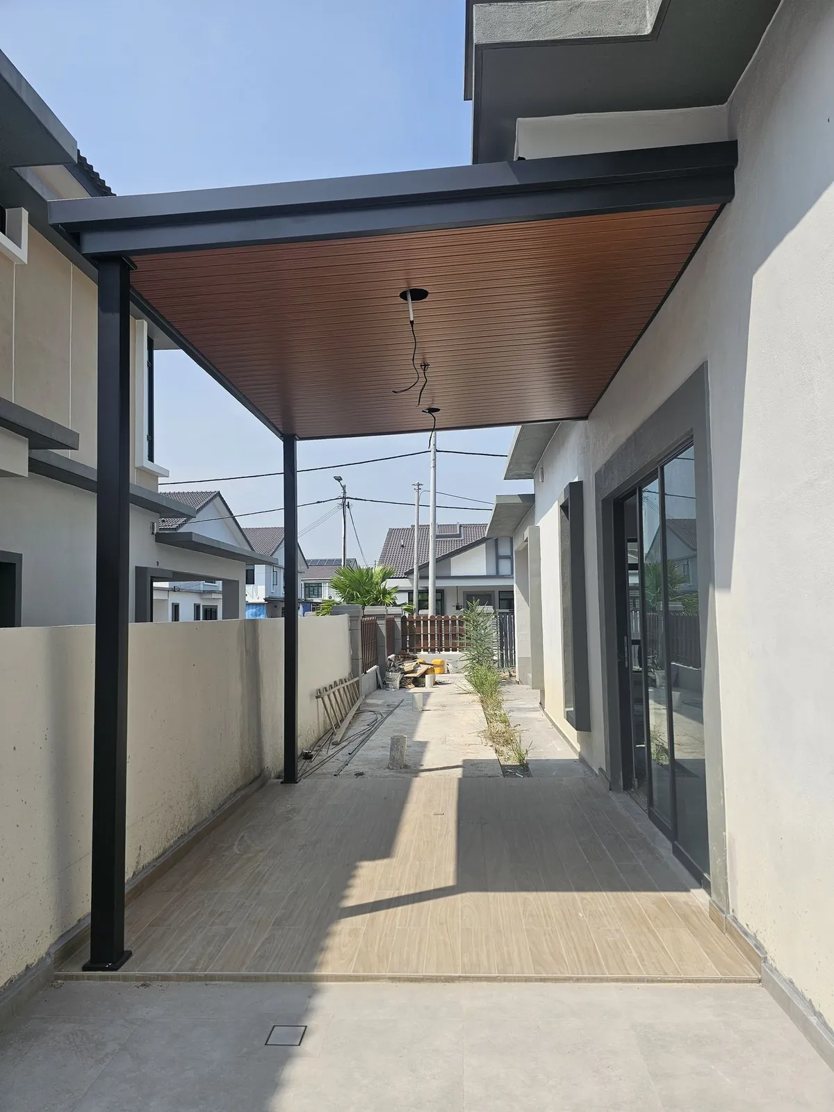 Jasin Parkland covered side walkway with steel posts and a timber-look ceiling