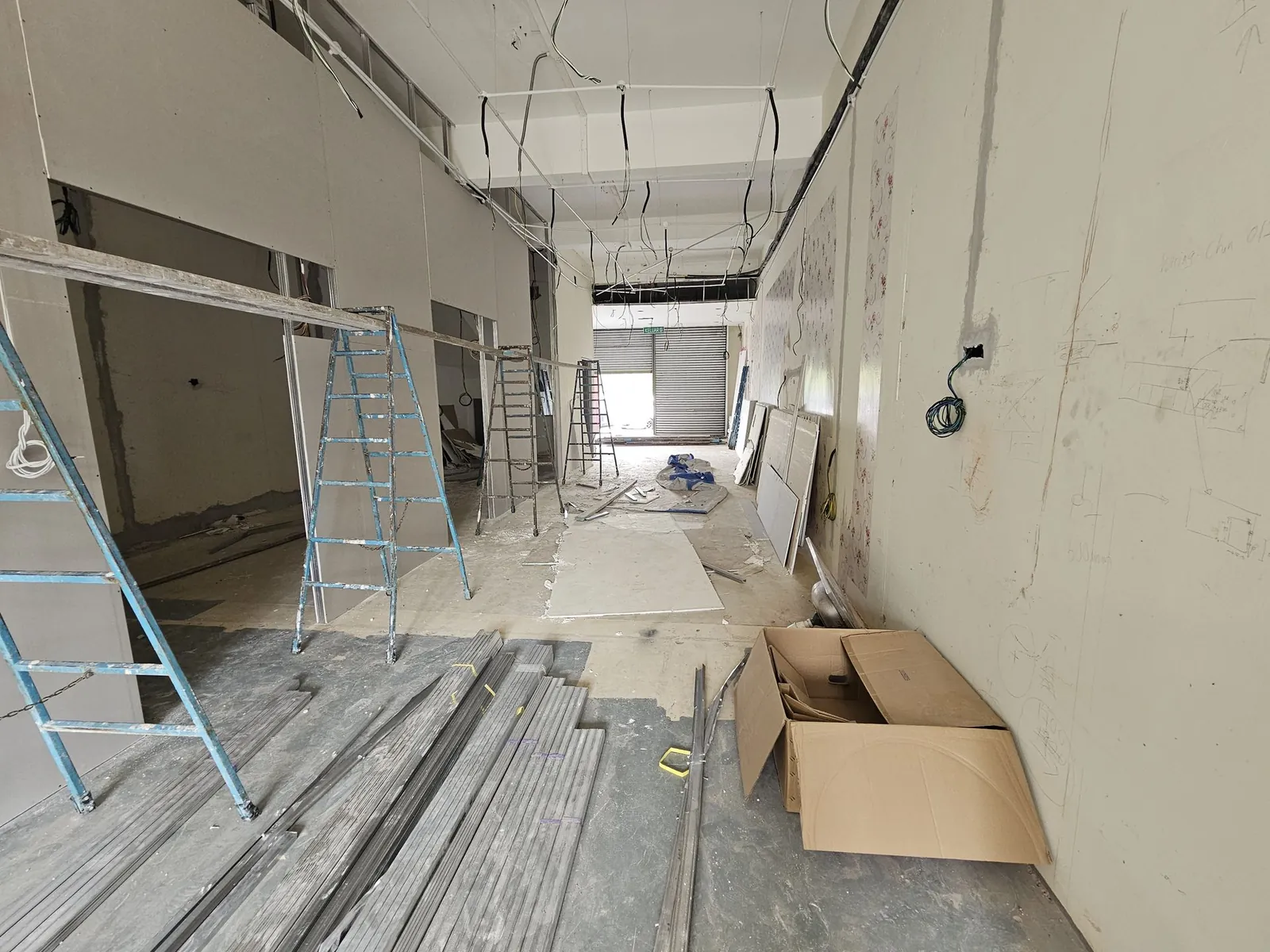 Kimvets Krubong long room with open ceiling, ladders and timber on floor