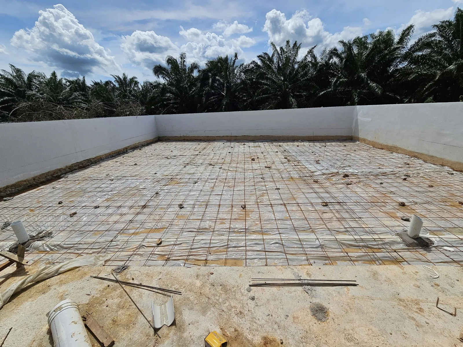 Jasin Parkland reinforcement mesh across the back yard toward the rear wall