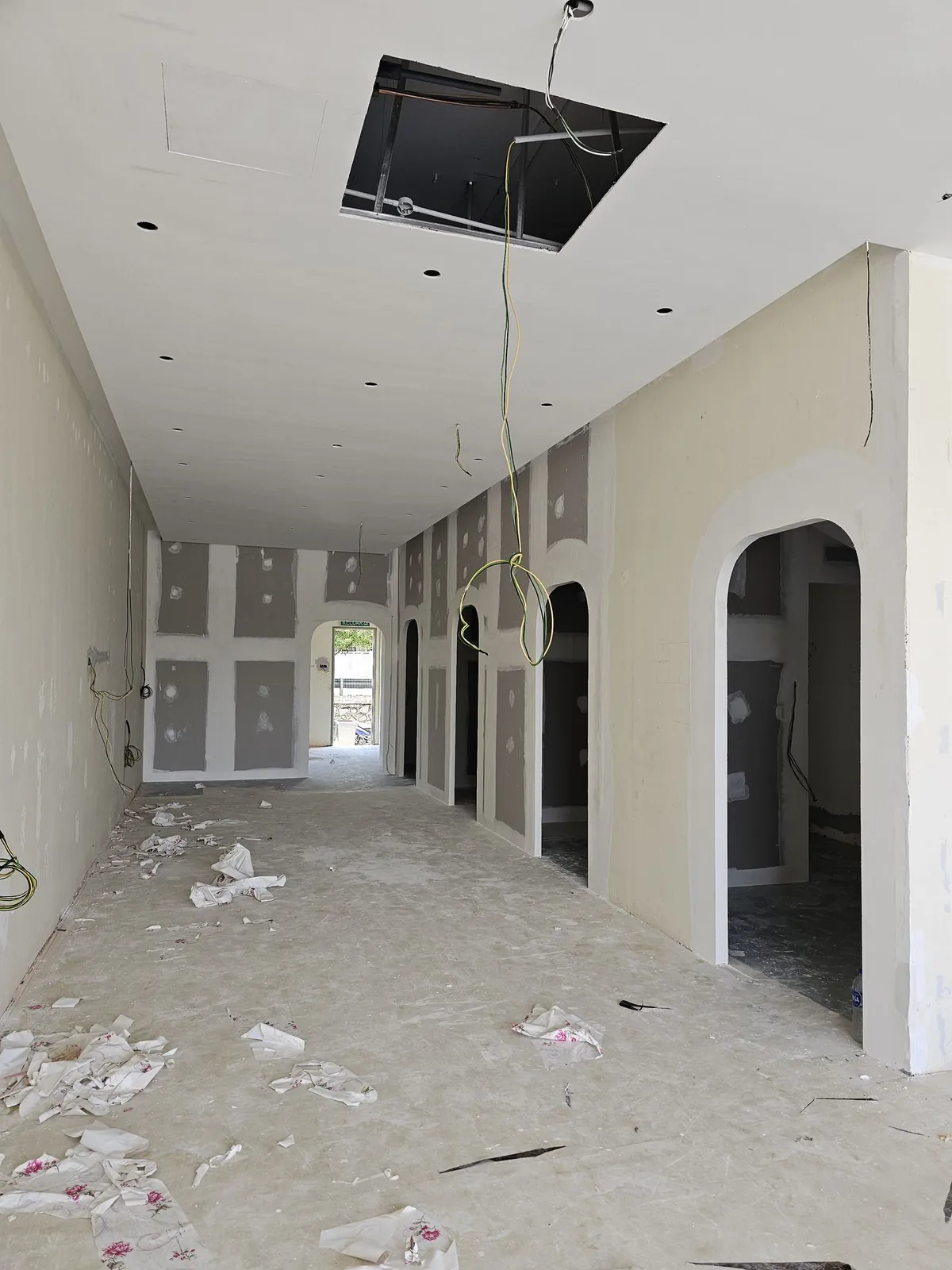 Kimvets Krubong corridor with patched gypsum arched doorways