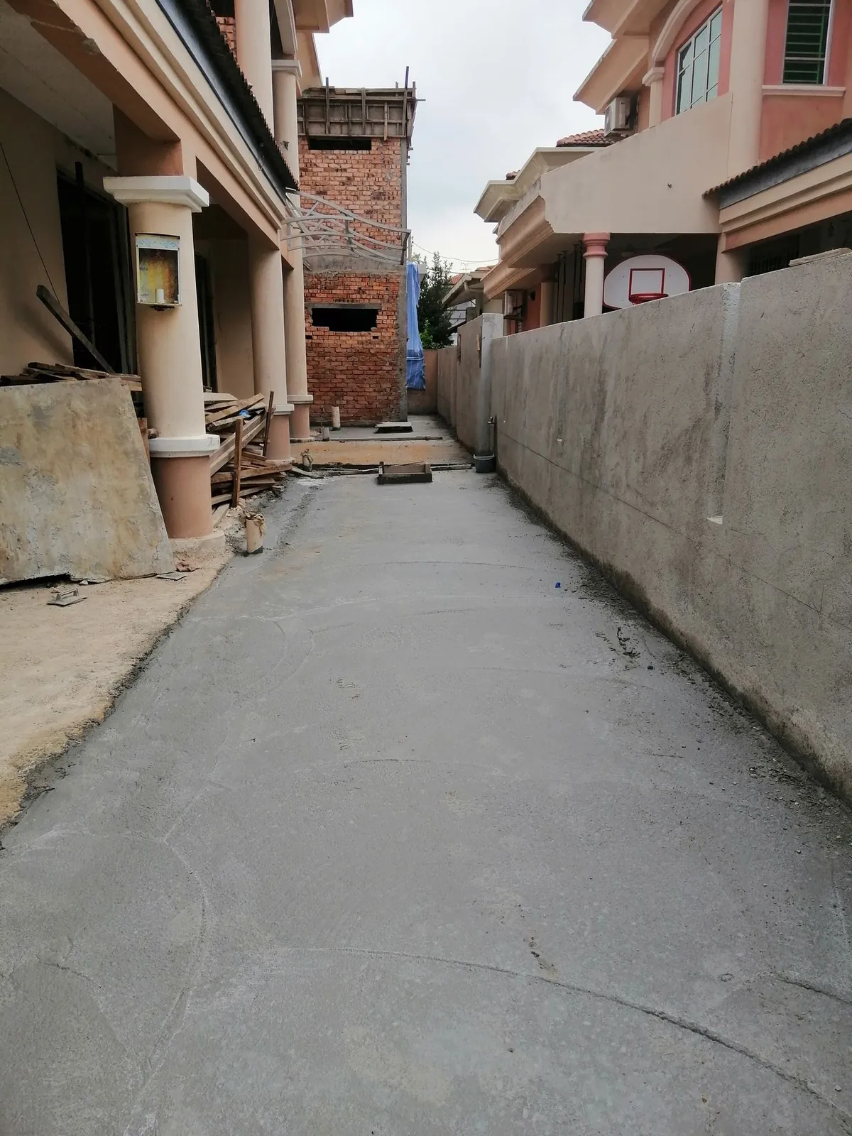 Taman Ara Permai side lane freshly concreted beside the new fencing wall
