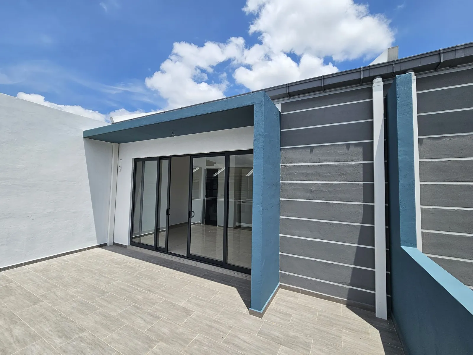 Bare upper terrace with sliding doors at a Country Villa terrace house