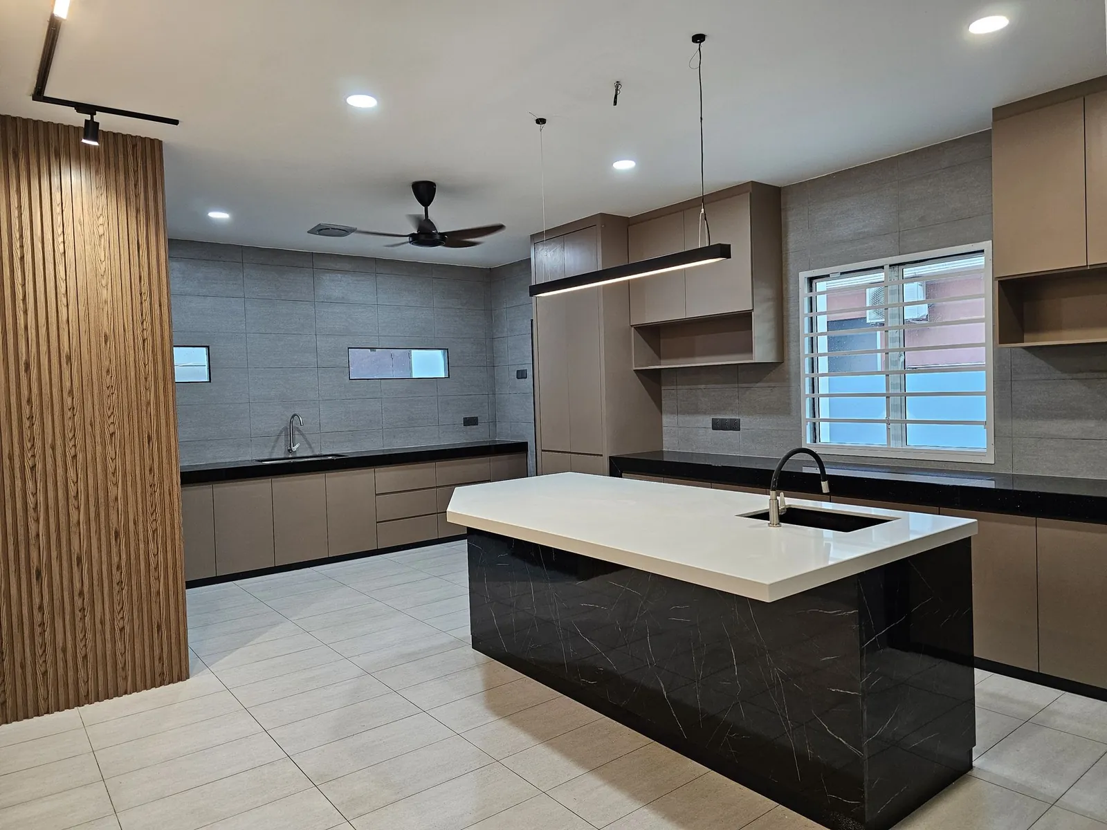 Wet kitchen extension with island and built-in cabinets by a Melaka renovation contractor at Taman Ara Permai