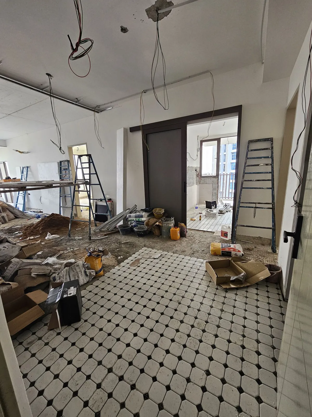 Bali Residence octagon floor tiles laid while ceiling work continues