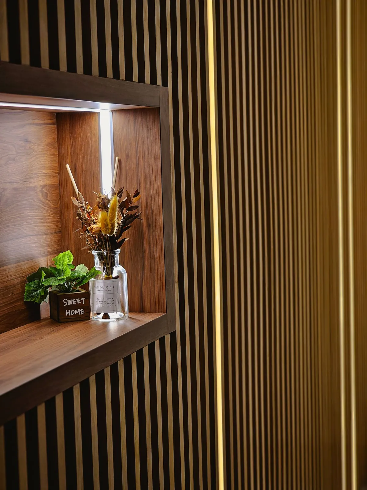 Taman Kesidang slatted wall with lit recessed display niche