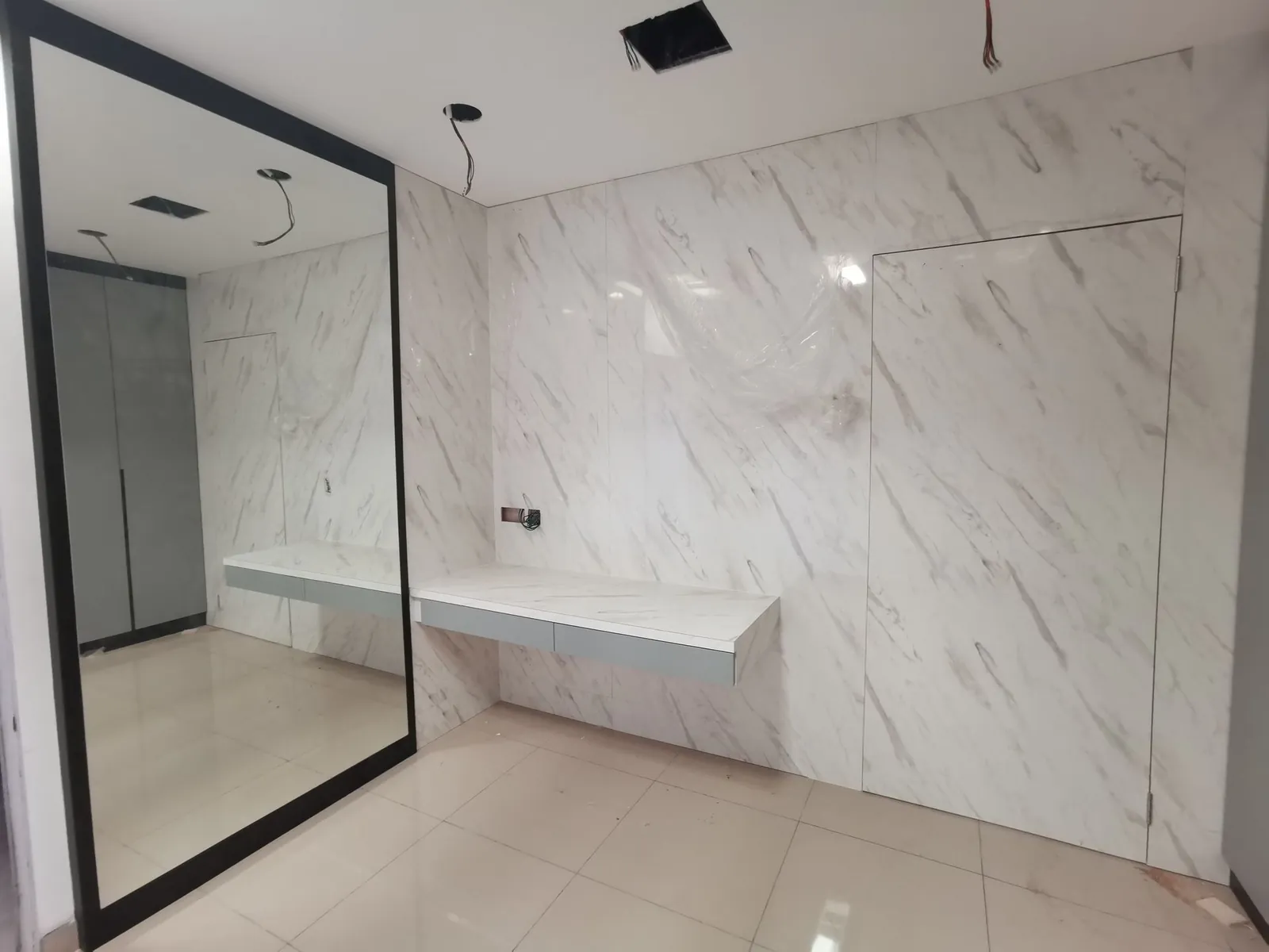 Taman Ara Permai bedroom near completion, marble-look wall and floating desk