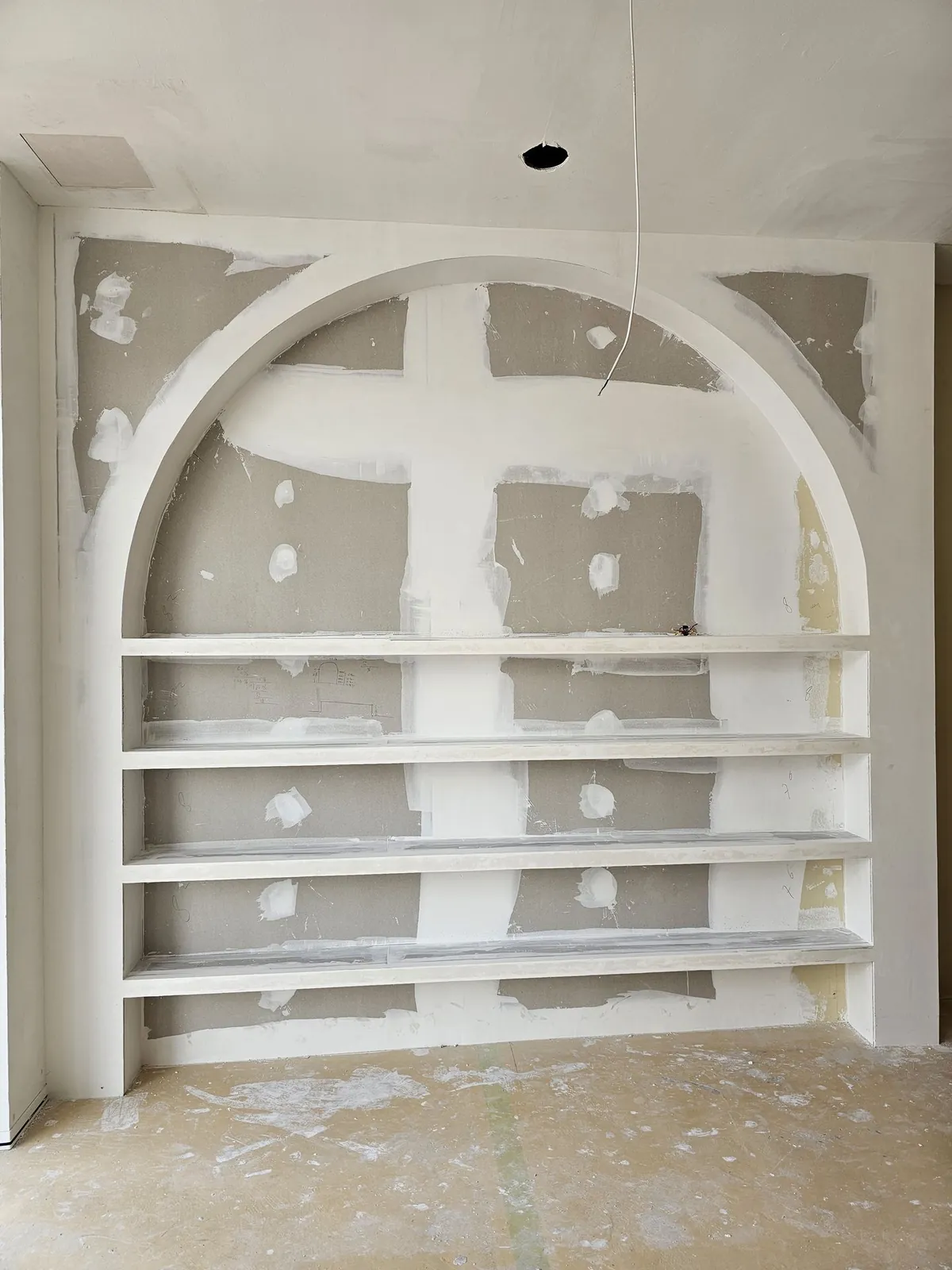 Good Skin Bar arched gypsum shelving, patched and unpainted