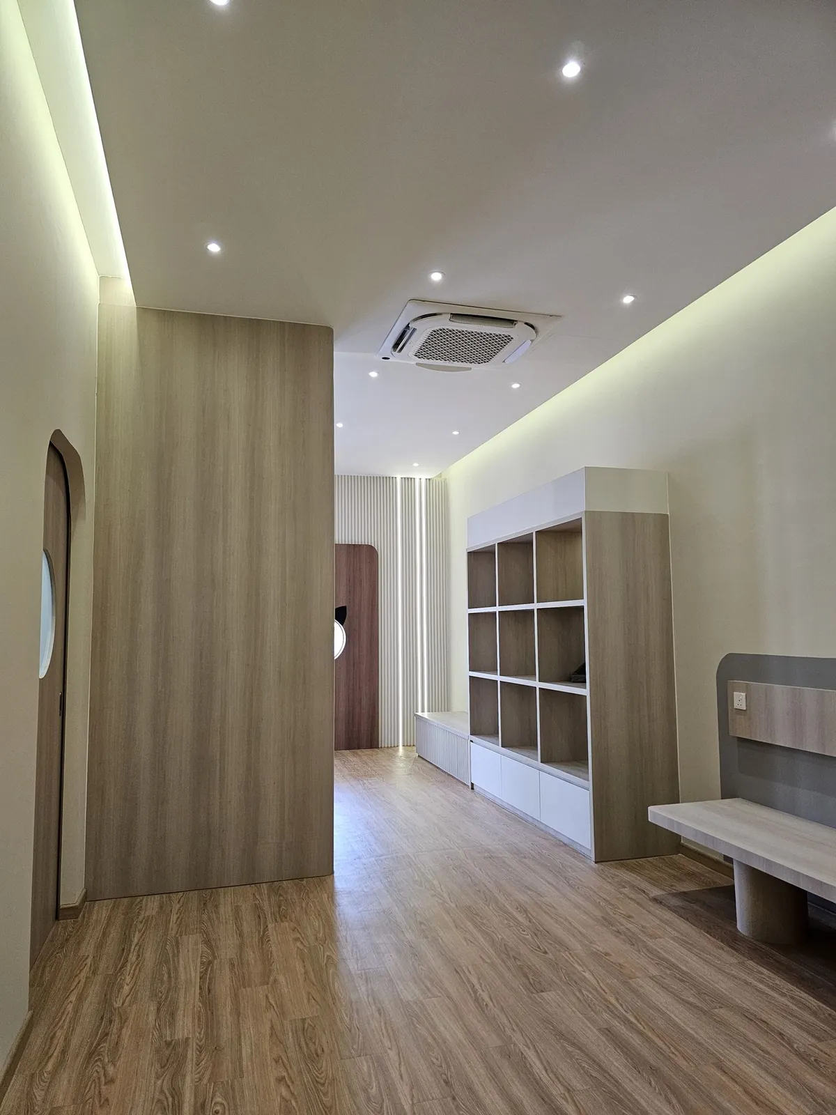 Kimvets Krubong vet clinic interior with timber shelving, bench and arched door