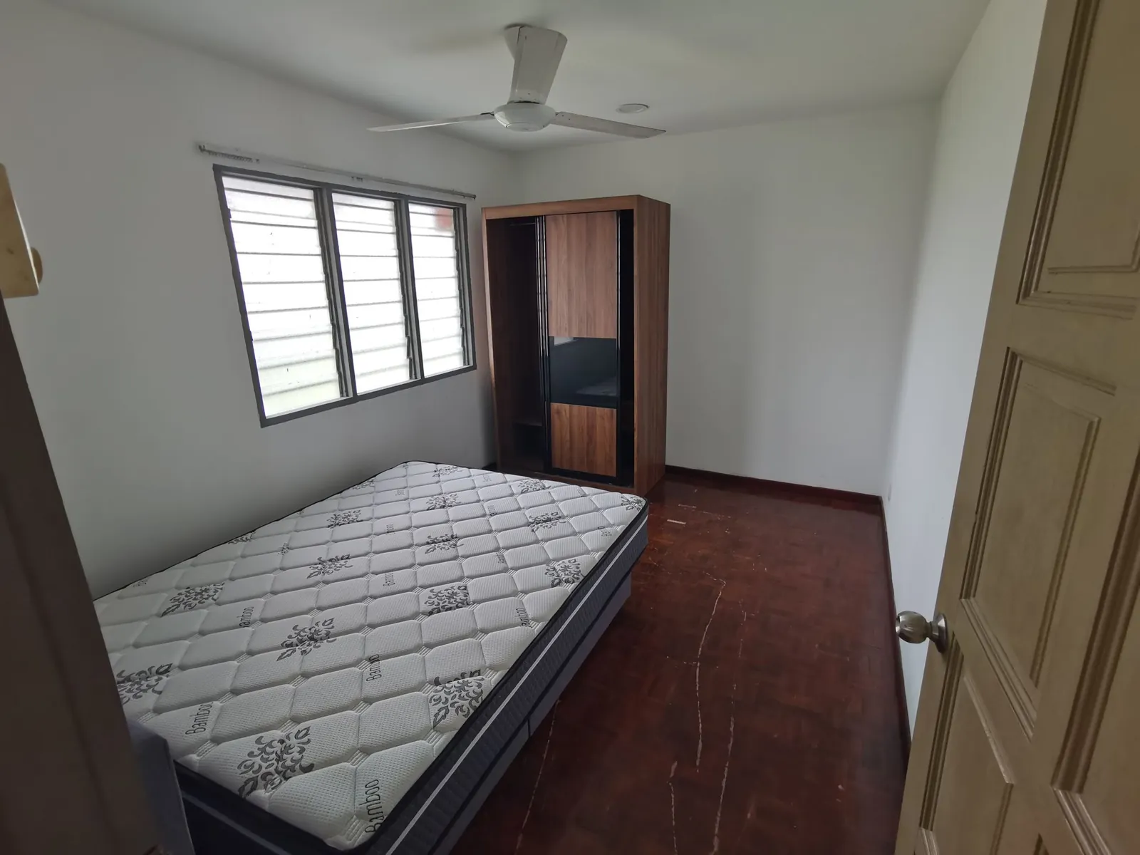 Taman Kesidang bedroom before, with old wood wardrobe and parquet floor