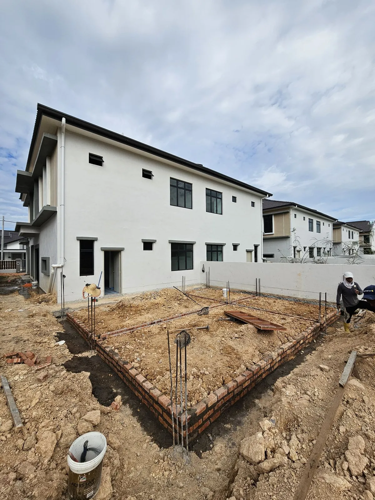 Jasin Parkland brick ground beams outlining the extension at the house rear