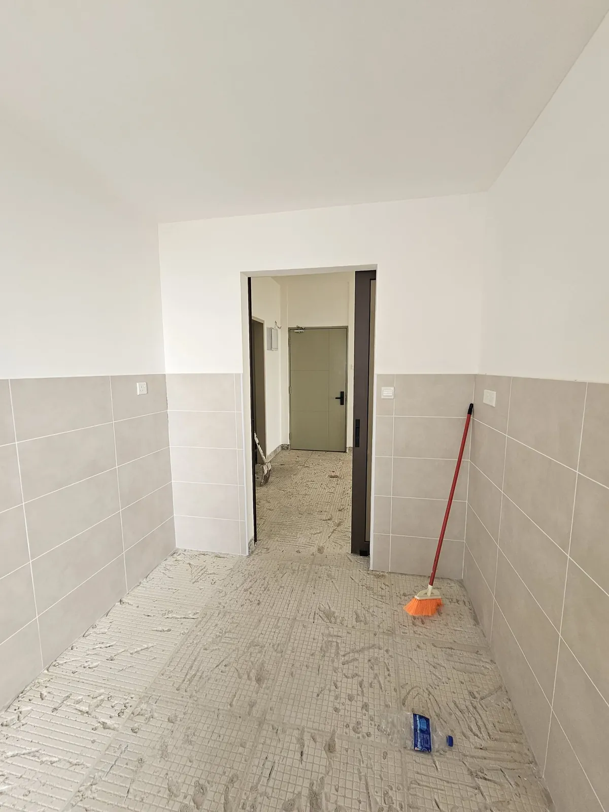 Bali Residence kitchen before work, looking toward the plain inner doorway