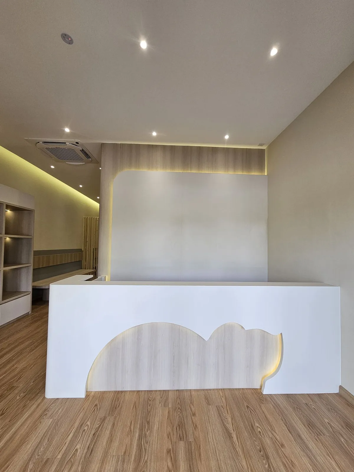 Reception counter with timber cat-silhouette front at Kimvets Krubong