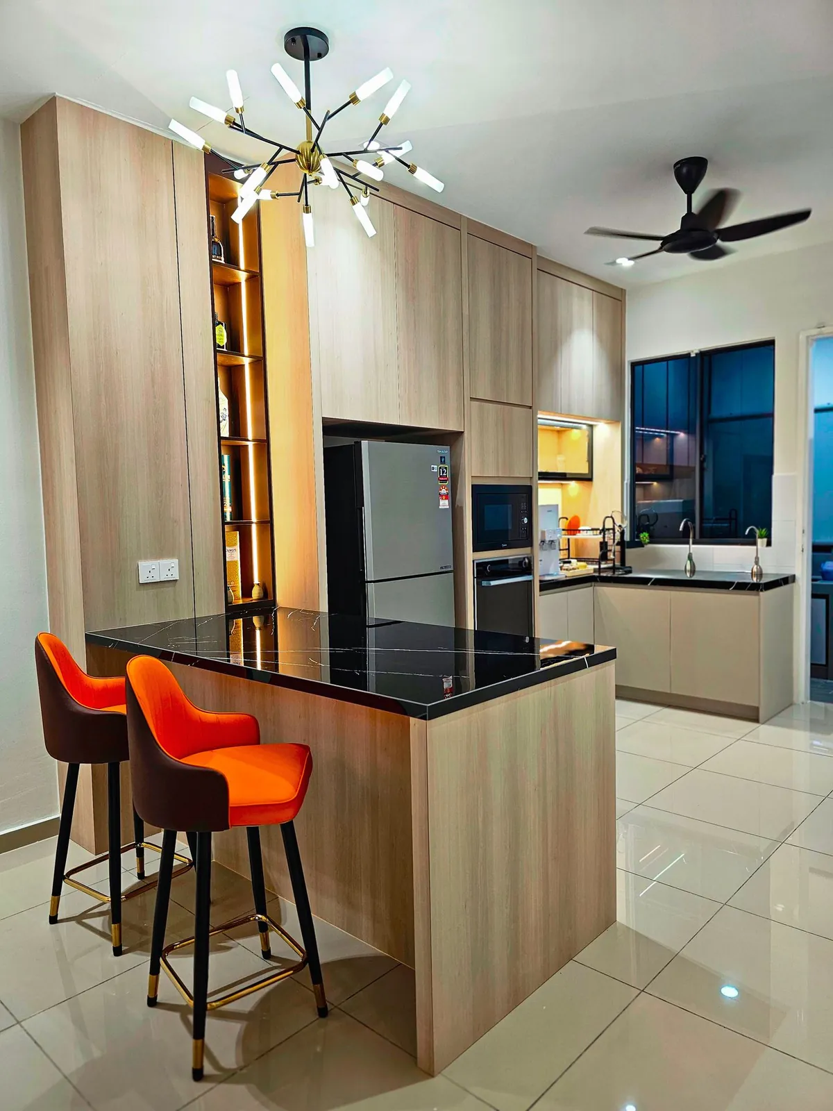 Kitchen island with tall wood-look cabinets and a lit niche, Country Villa