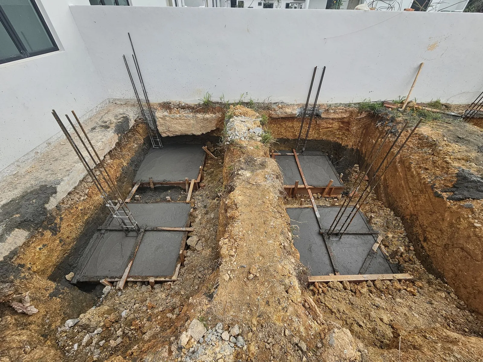 Jasin Parkland cast pad footings with column starter bars in the trenches